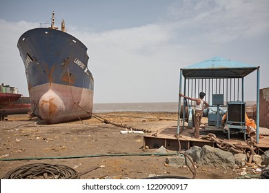 Alang, India, September 2008. Large Tonnage Cargo Ship Stranded On The Beach Waiting To Be Scrapped.