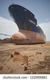 Alang, India, September 2008.Close Up Front View Of A Large Tonnage Cargo Ship Stranded On The Beach Waiting To Be Scrapped.