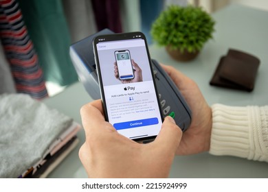 Alanya, Turkey - August 12 2019 : Man hand holding iPhone 8 with Apple Pay on the screen and pay pass online terminal. iPhone was created and developed by the Apple inc. - Shutterstock ID 2215924999