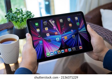 Alanya, Turkey - May 12, 2021: Man Hand Holding IPad Air IOS 14 With Widget On The Home Screen. IPad Was Created And Developed By The Apple Inc.