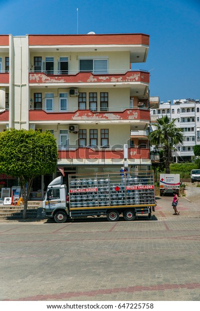 Alanya, Turkey - May, 5, 2017: Truck for\
transportation of gas cylinders. The car delivers gas to the shops,\
restaurants and residents of the city. The car is parked at the\
apartment building.