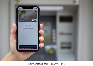 Alanya, Turkey - October 27, 2020: Woman hand holding iPhone 11 with app Raiffeisenbank on the screen. iPhone was created and developed by the Apple inc.