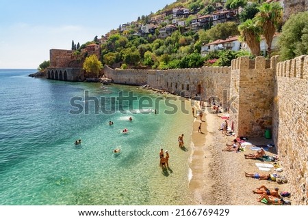 Alanya, Turkey - October 5, 2021: Awesome view of the Tersane and the beach by the coast of Alanya, Turkey. Amazing coastline. The ancient shipyard is a popular tourist attraction in Turkey.