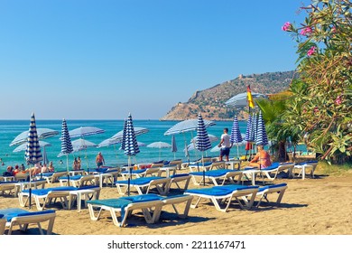 ALANYA, TURKEY - SEPTEMBER 16, 2022: People Relax On Famous Keykubat Beach In The Heart Of Alanya