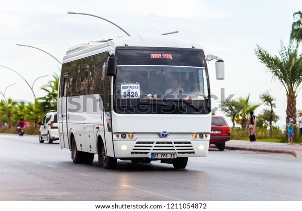 ALANYA / TURKEY - SEPTEMBER\
29, 2018: White bus from turkish bus company drives on a street in\
Alanya