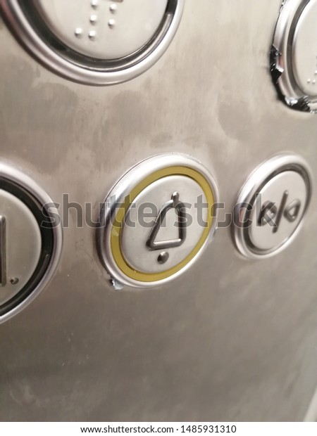 the alarm button in the\
Elevator