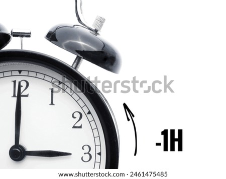 Alarm clock at 3 o'clock changing to Winter Time. Fall back or time change concept