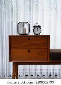 Alarm Clock And Candle On The Desk For Funiture Living Home Idea