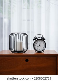 Alarm Clock And Candle On The Desk For Funiture Living Home Idea