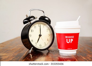 Alarm clock and coffee cup, Seven o'clock in the morning
