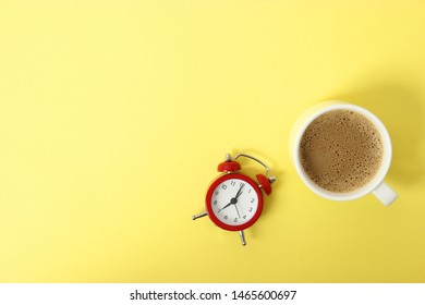 alarm clock and coffee on a colored background top view.
 - Shutterstock ID 1465600697