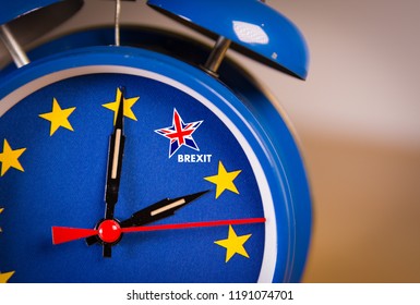 Alarm clock with the colors of the EU flag and one UK star. Representing the countdown for Brexit negociations and strategy concept between European Union and United Kingdom.