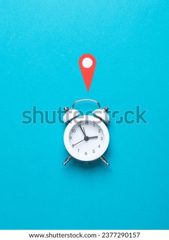Alarm clock and Geolocation Maps Marker point icon on blue background.