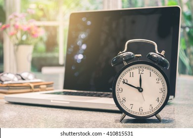 Alarm Clock With Laptop In The Background