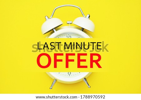 Alarm clock and Last minute offer text on yellow background.