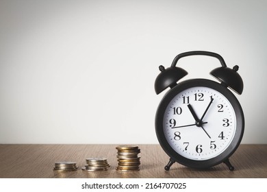 Alarm Clock And Money. Time Is Money. Coins On The Background Of The Clock. Money Leak. Payment Of Time According To The Price.