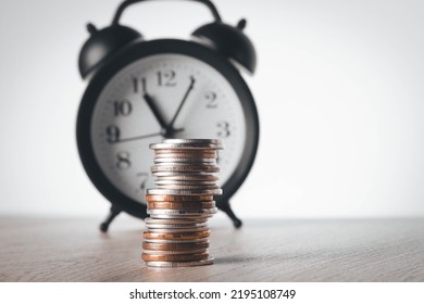 Alarm Clock And Money. Time Is Money. Coins On The Background Of The Clock. Money Leak. Payment Of Time According To The Price.