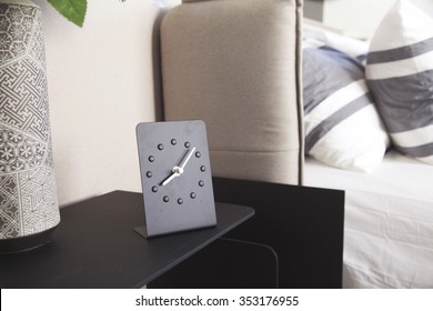 Alarm Clock On Bed Side Table