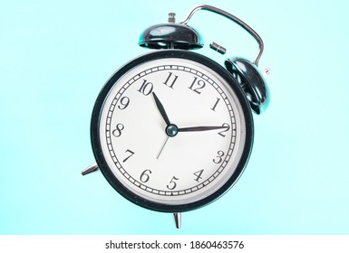 Alarm Clock On A Blue Background Isolated. Lost Time Concept. Business Idea. Lifestyle