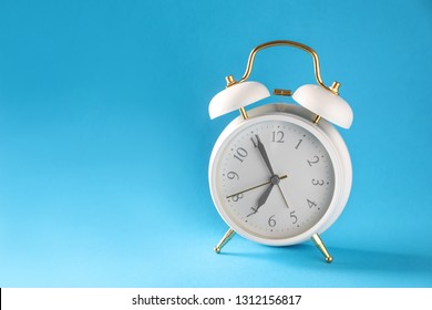 Alarm clock on color background - Shutterstock ID 1312156817