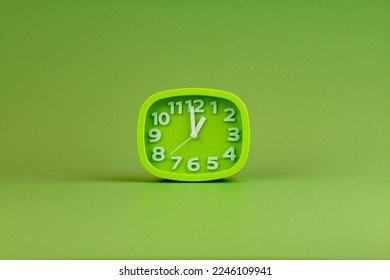 Alarm clock on green background, time concept, clock photo - Shutterstock ID 2246109941