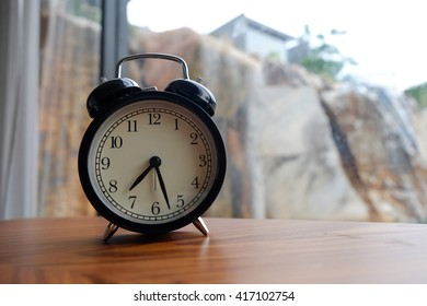 alarm clock on table