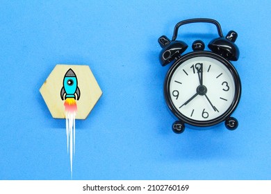 Alarm Clock And Rocket Upwards. Business Start -up Concept. Rocket Startup. Time To Start