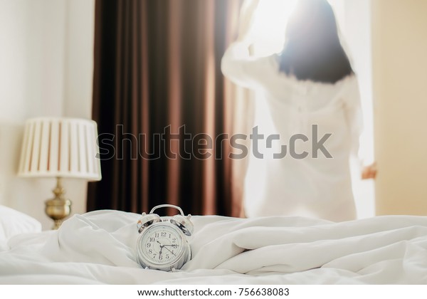 Alarm Clock Standing On White Bed Stock Image Download Now