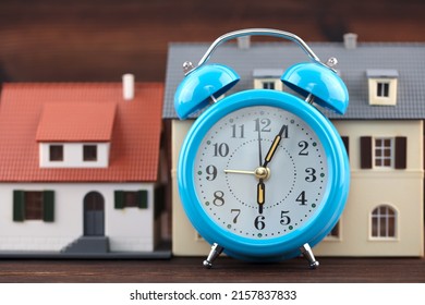 Alarm Clock Clock And Tiny House Model