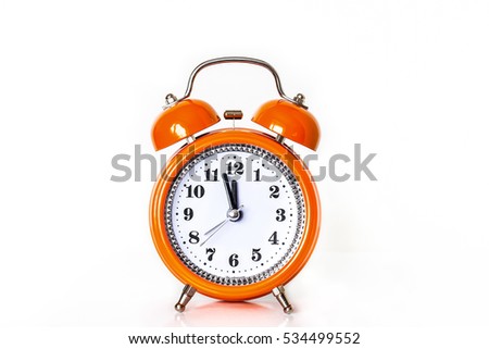 Alarm clock with watch-hands showing midnight or noon, front view