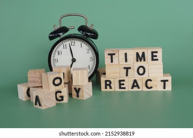 Alarm Clock With Wooden Cubes. Time To React Concept