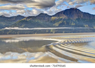 Alaska Bore Tide With Mountains In The Background