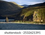 Alaska, coast of Unalaska Island in the evening sun, Aleutian Islands, USA