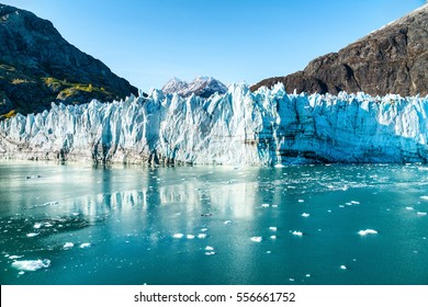 Alaska Glacier Bay landscape view from cruise ship holiday travel. Global warming and climate change concept with melting glacier with Johns Hopkins Glacier and Mount Fairweather Range mountains. - Shutterstock ID 556661752