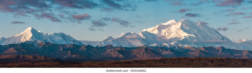 The Alaska Range remains covered in snow during all times of year due to its high elevation. The snow capped mountains provide a beautiful contrast from the view at Wonder Lake.  - Powered by Shutterstock