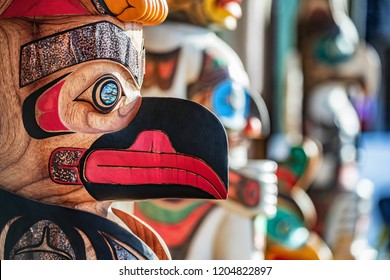 Alaska totem pole carving art sculture store in tourist travel attraction town on Alaska cruise. Ketchikan, Juneau, Skagway stores and shops selling native paintings and art. Closeup of an Eagle.