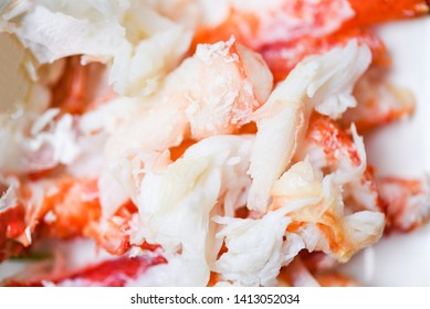 Alaskan crab meat on white plate for cooked seafood / Close up of steamed crab  