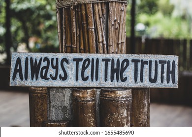 Alawyas tell the truth on wooden panel - Shutterstock ID 1655485690