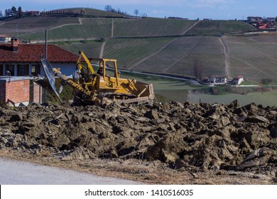 Alba, Cuneo / Italy 03-11-2019: 	Soil handling vineyard processing in Alba with scraper, Cuneo italy - Shutterstock ID 1410516035