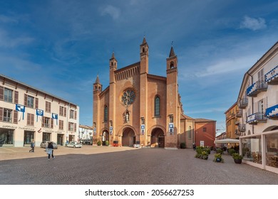 Alba, Cuneo, Piedmont, Italy - October 12, 2021: Piazza Duomo with  Cathedral of San Lorenzo and the palaces with the banners of the historic donkey race at the time of the truffle fair