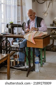 Albania, May 12, 2022 - Man Works At Tread-powered Sewing Machine