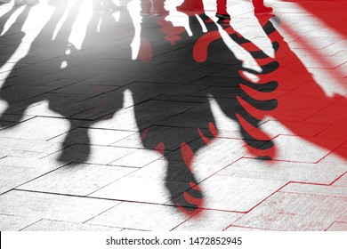 Albanian Flag And Shadows Of People As Citizens Of Country, Conceptual Picture