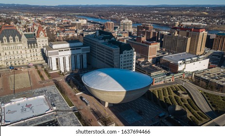 Albany, New York - 31 January 2020: Empire State Plaza Ice Rink, State Capitol Building And The Egg