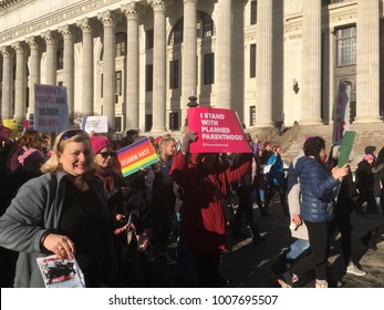 Albany, New York, USA - 20 January 2018: Woman Holds A Sign “I Stand With Planned Parenthood” As She Marches With The Protesting Crowd For Women’s Rights In The Second Annual Women’s March In Albany.