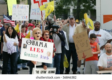 ALBANY, NY- SEPT 10: Protesters Hold Signs Against Universal Healthcare During A Stop Of The Tea Party Express Tour On September 10, 2009 In Albany NY