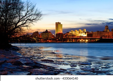 Albany NY Skyline Wintertime, From Rennsaeler NY, Looking Across. Reflections On The Hudson River Include Some Ice. Capital City Of NY.