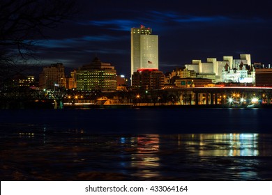 Albany NY Skyline Wintertime, From Rennsaeler NY, Looking Across. Reflections On The Hudson River Include Some Ice. Capital City Of NY.