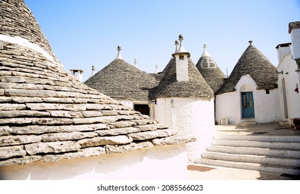 Alberobello is a city in Puglia, Italy. It is known for the Trulli, white conical stone buildings, present by the hundreds in the hilly district of Rione Monti.