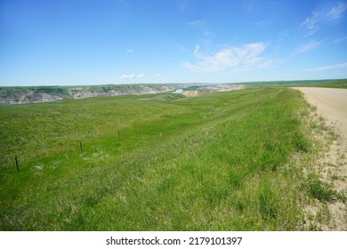 Alberta Badlands Landscape With Fields Hills And Road