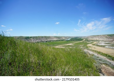 Alberta Badlands Landscape With Fields Hills And Road